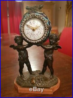 Superbe pendule en bronze et émail cloisonné, XIX ème, décor angelot